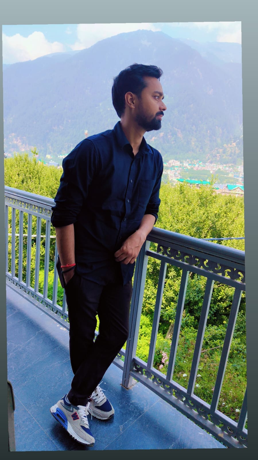 A wide open green field under the afternoon sun